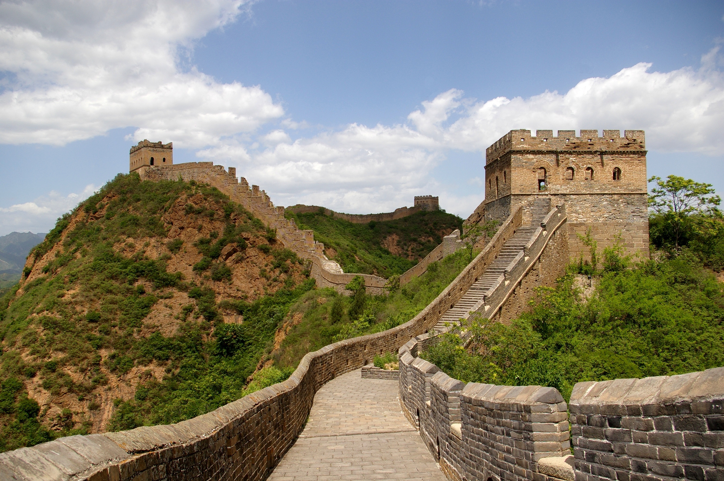 The unrestored wall at Jinshanling crossing golden autumn hills