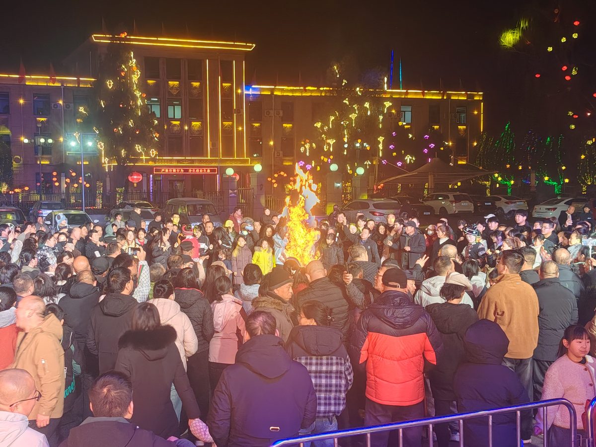 A busy crowd gathering at a Chinese temple fair