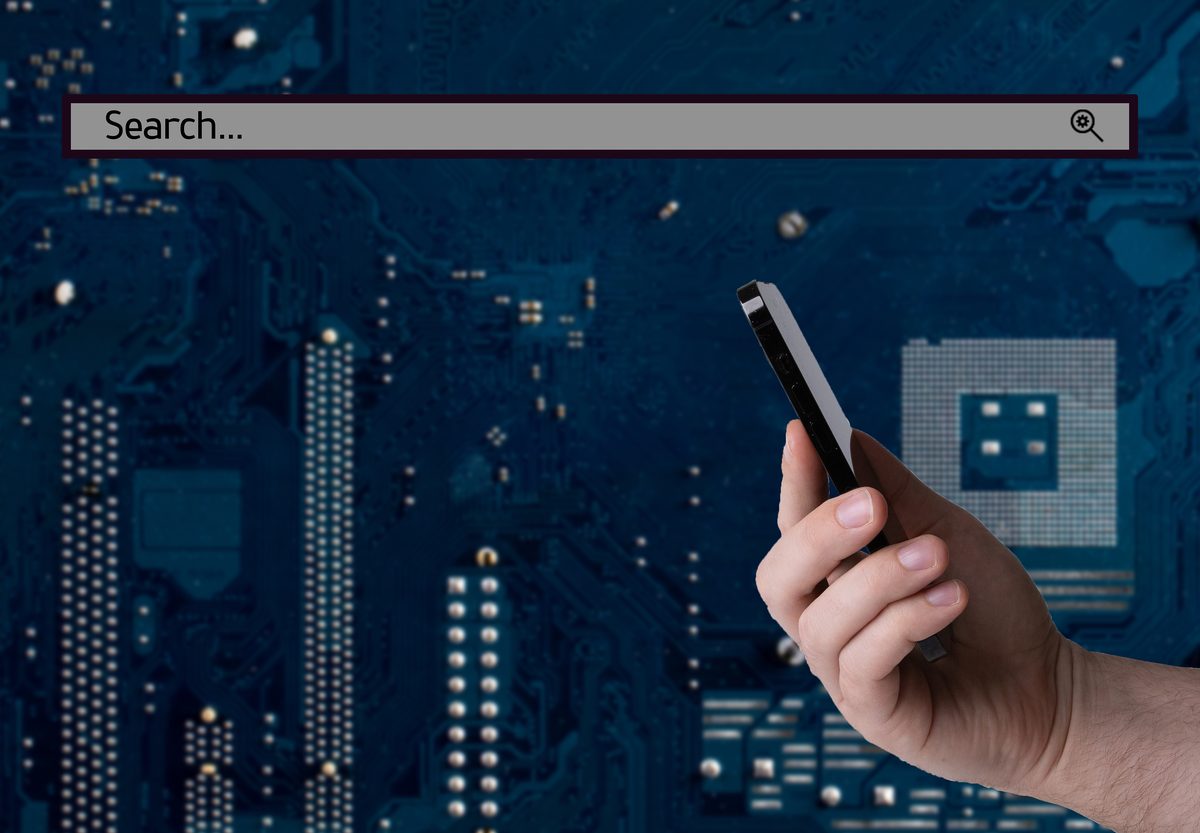 Hand holding a smartphone, showing the importance of staying connected