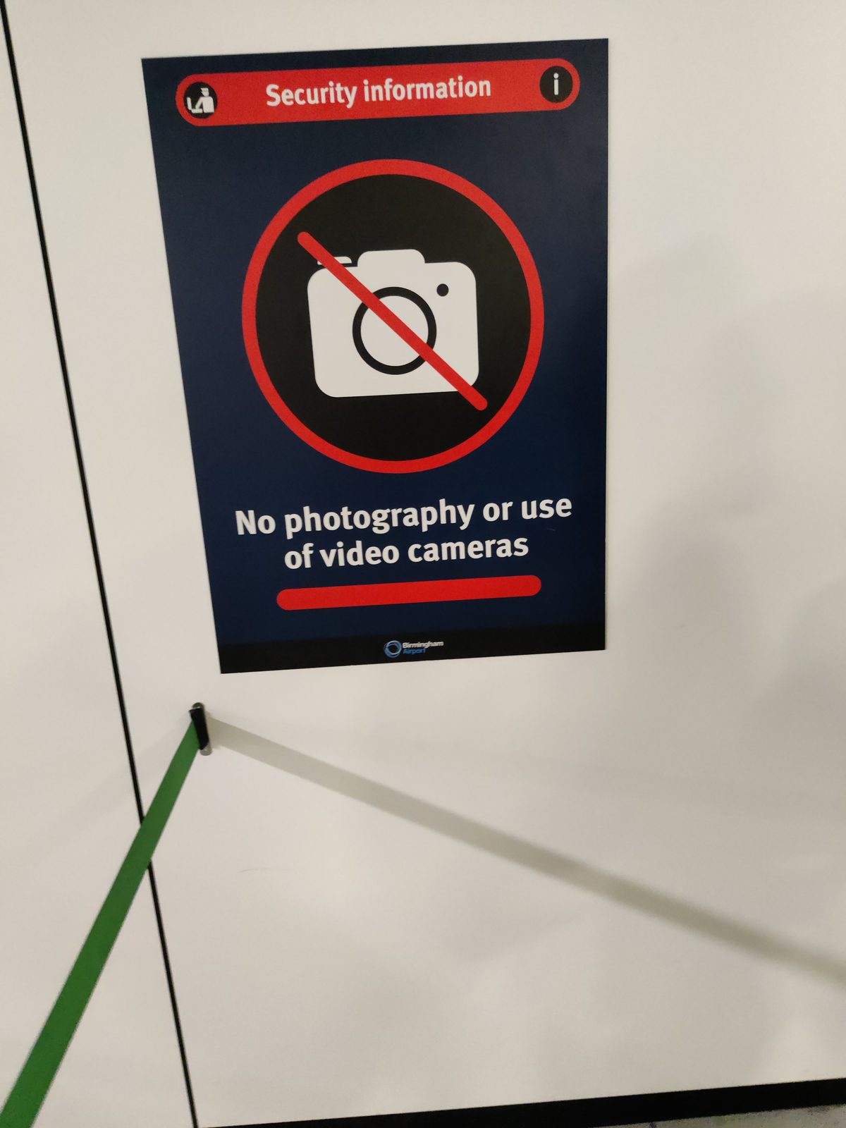 A no-photography sign at a security checkpoint