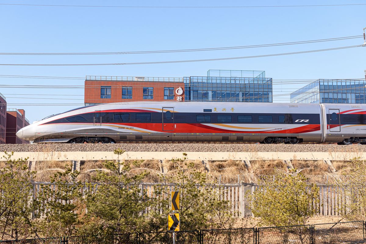 A high-speed train passing through the countryside