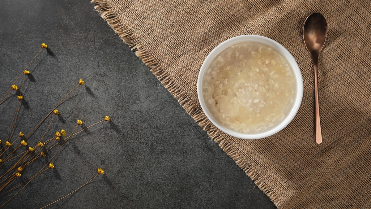 A warm bowl of congee rice porridge with toppings
