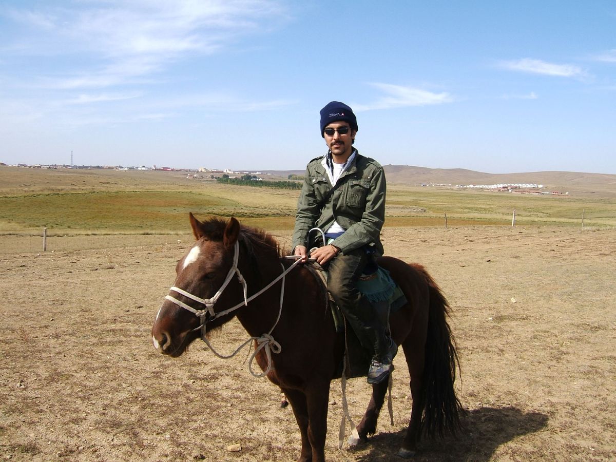 Horse riding across the Xilamuren grassland near Hohhot