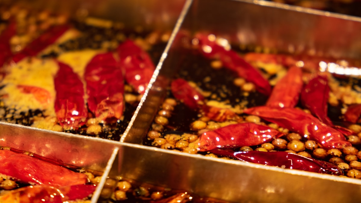 A hotpot dipping sauce bar with sesame paste and chili oil