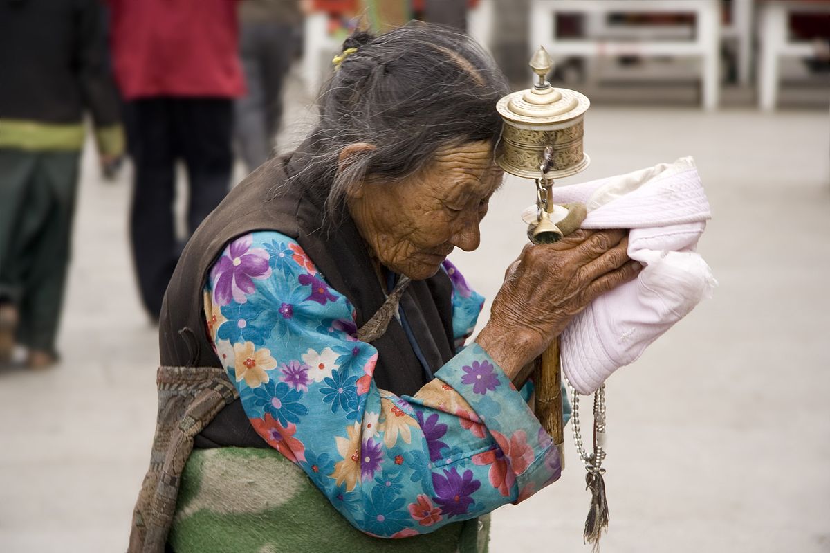 File:An elderly Tibetan women holding a prayer wheel on Lhasa, Barkhor.jpg