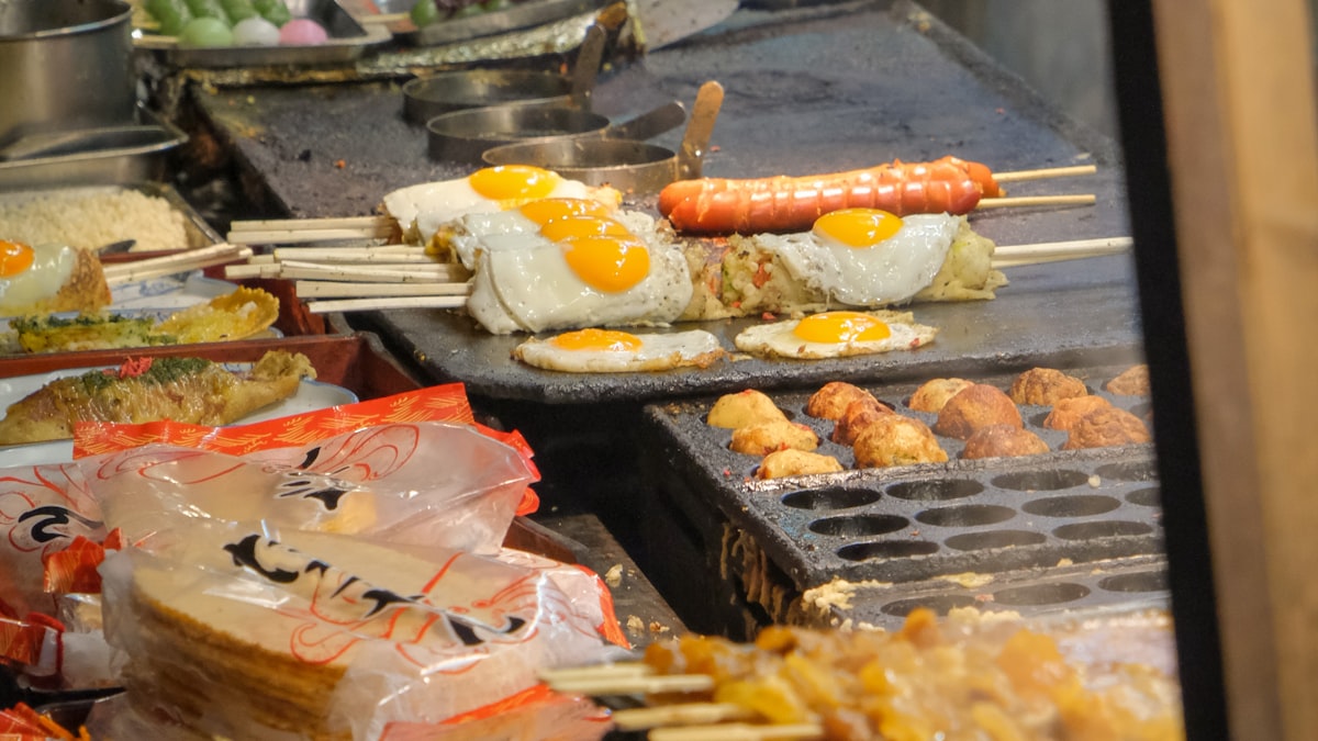 Grilled skewers over charcoal at a Chinese night market