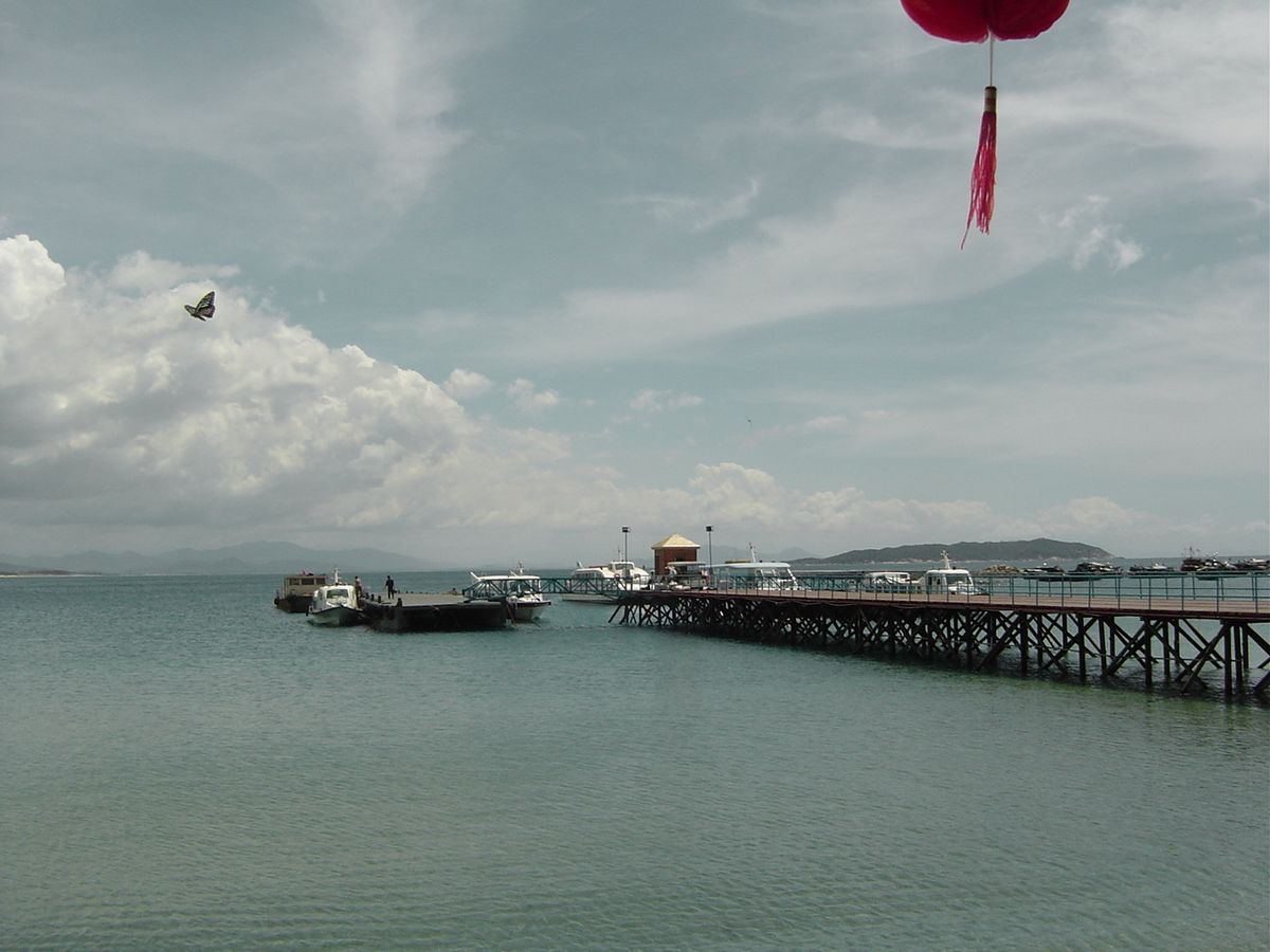 The clear water and rocky coast of Wuzhizhou Island off Sanya